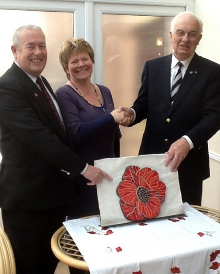 A poppy mosaic is presented to the Stoke Gifford branch of the RBL.