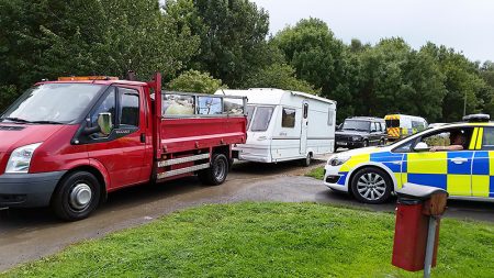 Travellers' vehicles leave Forty Acres, Stoke Gifford on Friday 18th August 2017.