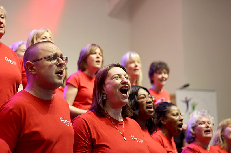 Photo showing some members of Stoke Gifford gospel choir singing during a performance.