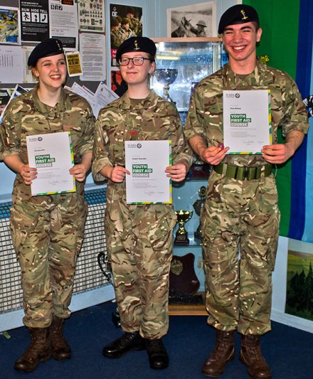 Photo of Sgt Gurr, L/Cpl Reynolds and Cdt Bishop receiving their Youth First Aid certificates.