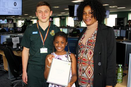 Photo of Jonathan Leaton (emergency medical dispatcher) with Massa Sow and Catherine Camara.
