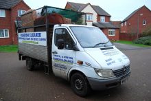 Photo of a rubbish collection vehicle.