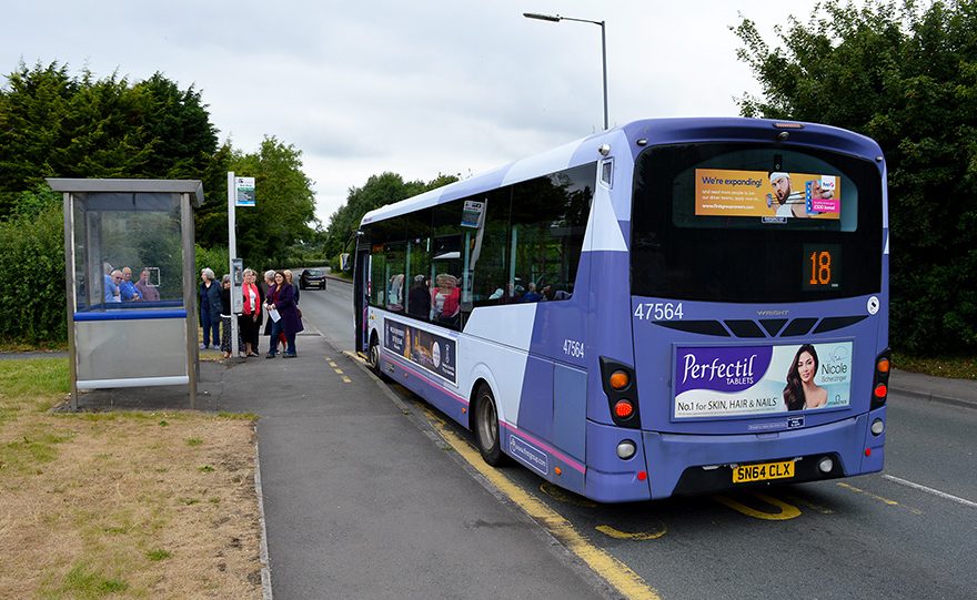 Photo of a bus waiting at a stop on Hatchet Road.