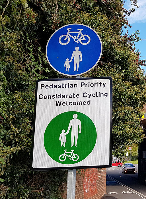 Photo of a 'pedestrian priority' sign.