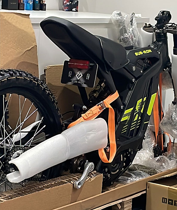 Photo of a partly unpacked electric motorcycle.