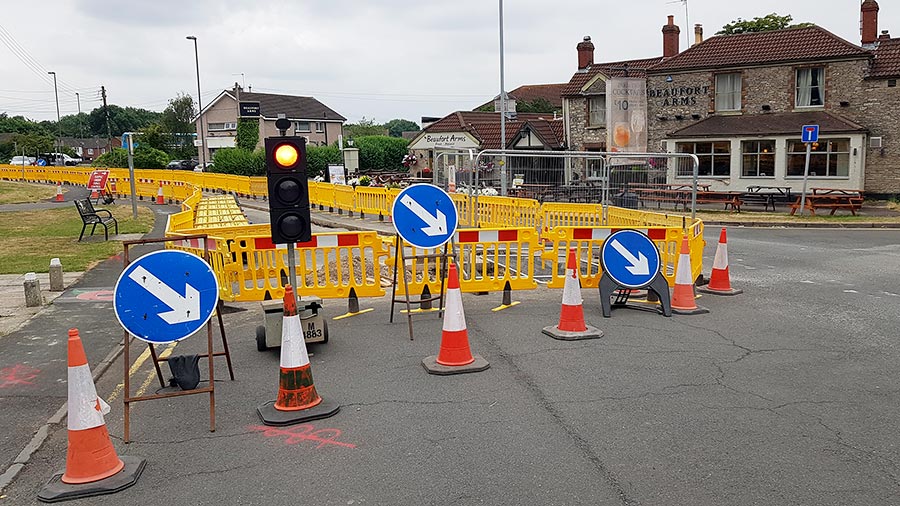 Photo of temporary traffic lights at roadworks.