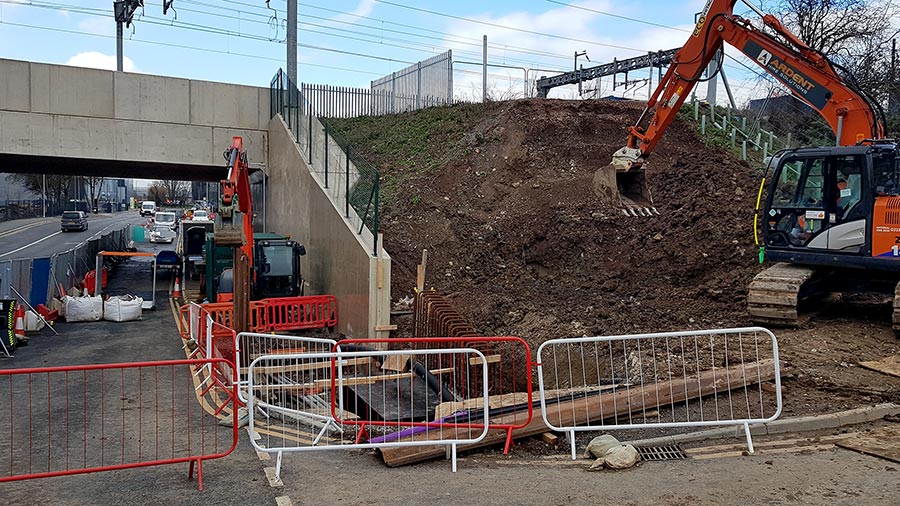 Photo of works under way on a railway embankment.