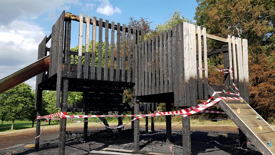 Photo of fire-damaged play equipment.