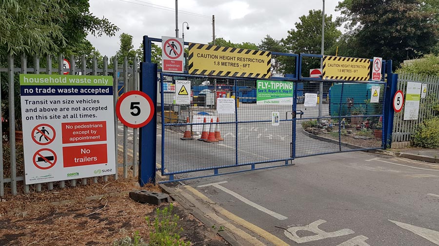 Photo of the (closed) entrance to a council recycling centre.