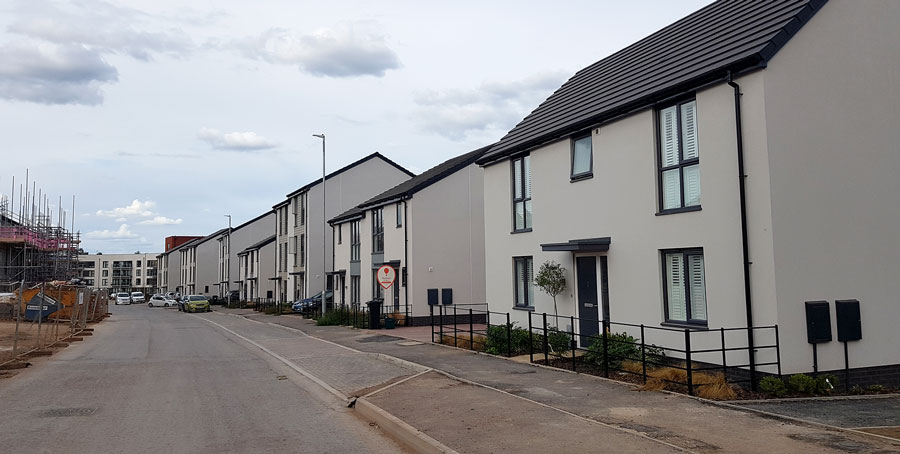 Photo of a street in a new housing development.
