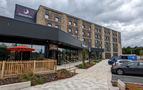 Photo of a Beefeater restaurant with a Premier Inn in the background.
