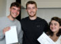 Photo of a group of students holding envelopes.